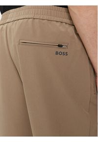 BOSS Spodnie dresowe T_Flex 50495491 Beżowy Tapered Fit. Kolor: beżowy. Materiał: syntetyk #4