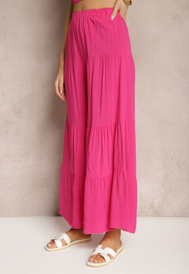 Renee - Ciemnoróżowe Spodnie z Szerokimi Nogawkami Palazzo z Falbankami i Gumką w Pasie Dimlin. Okazja: na spotkanie biznesowe, do pracy. Kolor: różowy. Materiał: materiał. Wzór: aplikacja. Styl: elegancki, biznesowy