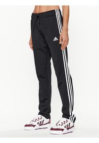 Adidas - adidas Spodnie dresowe Essentials Warm-Up 3-Stripes H48451 Czarny Regular Fit. Kolor: czarny. Materiał: syntetyk