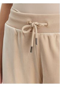 Guess Spodnie dresowe V3BB27 K0232 Beżowy Regular Fit. Kolor: beżowy. Materiał: syntetyk #4
