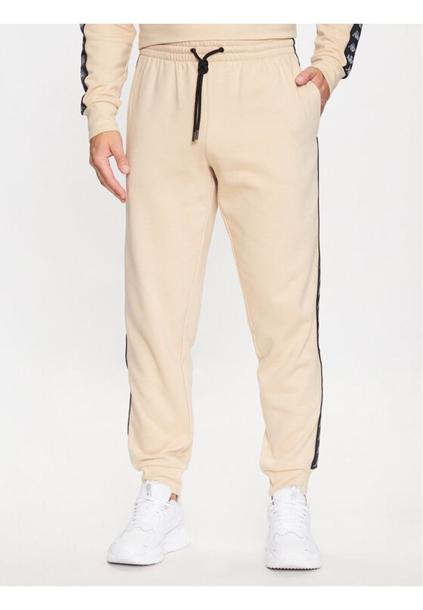 Kappa Spodnie dresowe 313014 Beżowy Regular Fit. Kolor: beżowy. Materiał: bawełna