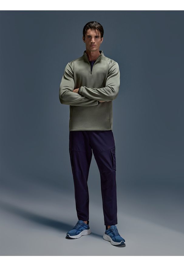 4f - 4F Spodnie treningowe szybkoschnące męskie - granatowe XL. Kolor: niebieski. Materiał: dzianina, elastan, włókno, syntetyk, materiał. Wzór: nadruk, ze splotem. Sport: fitness