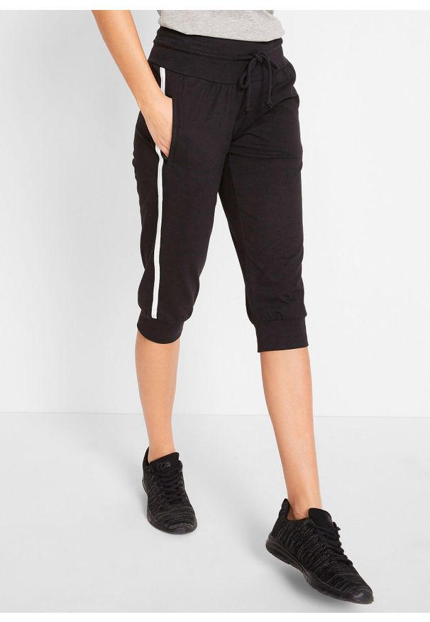 bonprix - Spodnie sportowe 3/4 z bawełny. Kolor: czarny. Materiał: bawełna. Wzór: paski. Styl: sportowy