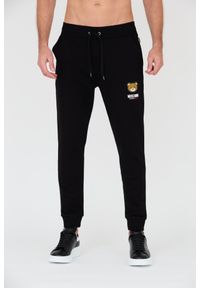MOSCHINO Czarne męskie spodnie dresowe, Rozmiar M. Kolor: czarny. Materiał: dresówka