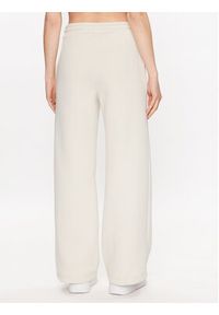 Calvin Klein Jeans Spodnie dresowe J20J221296 Écru Relaxed Fit. Materiał: dresówka, syntetyk