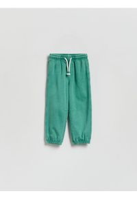 Reserved - Dresowe spodnie z efektem sprania - miętowy. Kolor: miętowy. Materiał: dresówka