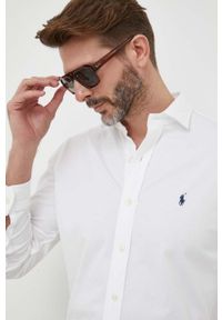 Polo Ralph Lauren koszula bawełniana męska kolor biały regular z kołnierzykiem klasycznym. Typ kołnierza: kołnierzyk klasyczny, polo. Kolor: biały. Materiał: bawełna. Długość rękawa: długi rękaw. Długość: długie. Wzór: aplikacja. Styl: klasyczny #5