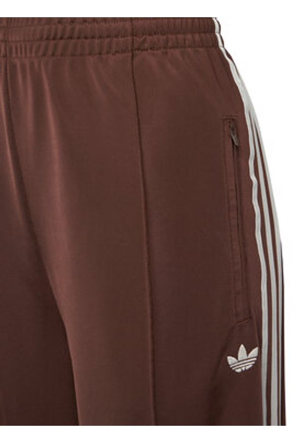 Adidas - adidas Spodnie dresowe adicolor Firebird KD2526 Brązowy Loose Fit. Kolor: brązowy. Materiał: syntetyk