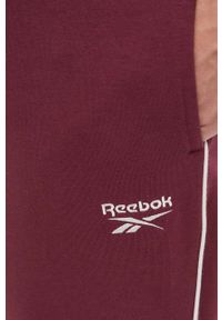 Reebok spodnie dresowe kolor bordowy gładkie. Kolor: czerwony. Materiał: dresówka. Wzór: gładki #2