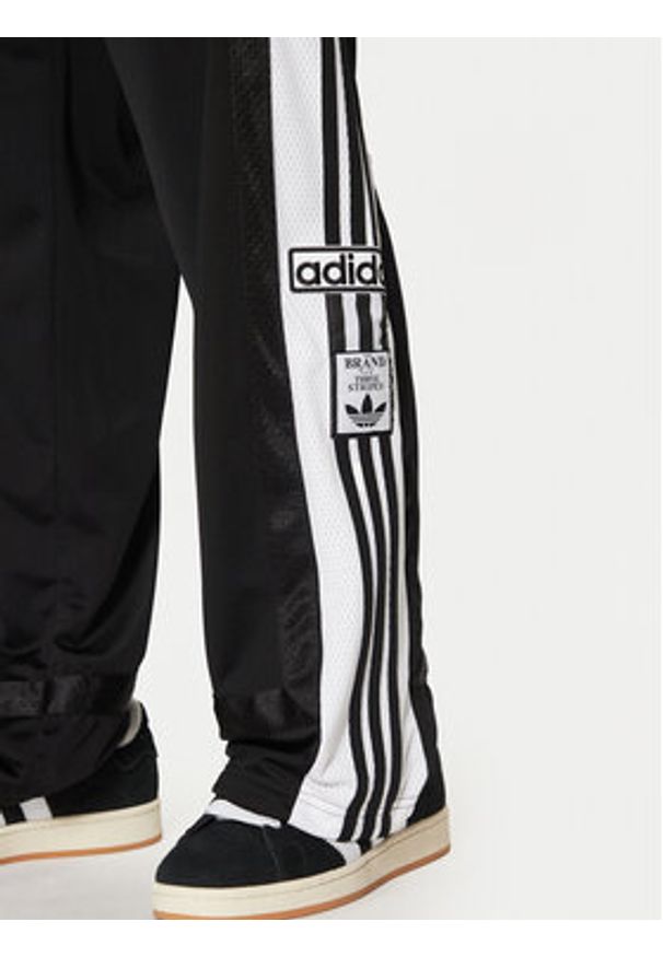 Adidas - adidas Spodnie dresowe Adibreak JD4267 Czarny Loose Fit. Kolor: czarny. Materiał: syntetyk