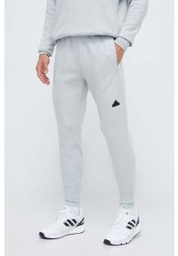 Adidas - adidas spodnie dresowe Z.N.E kolor zielony gładkie. Kolor: zielony. Materiał: dresówka. Wzór: gładki. Sport: fitness #1