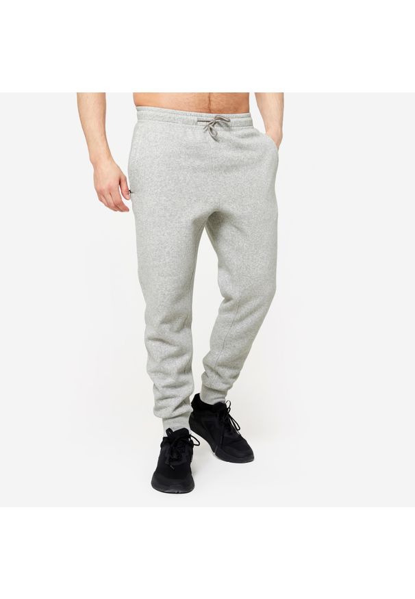DOMYOS - Spodnie dresowe męskie Domyos Gym & Pilates. Kolor: szary. Materiał: poliester, bawełna, materiał. Wzór: ze splotem. Sezon: zima. Sport: joga i pilates