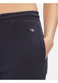 GANT - Gant Spodnie dresowe Rel Shield 4204921 Granatowy Relaxed Fit. Kolor: niebieski. Materiał: dresówka, bawełna