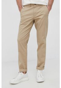 GAP Spodnie męskie kolor beżowy dopasowane. Kolor: beżowy. Materiał: tkanina. Wzór: gładki