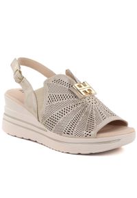 Skórzane sandały damskie na platformie koturn złoty M.Daszyński 25144-4. Kolor: złoty. Materiał: skóra. Obcas: na koturnie #1