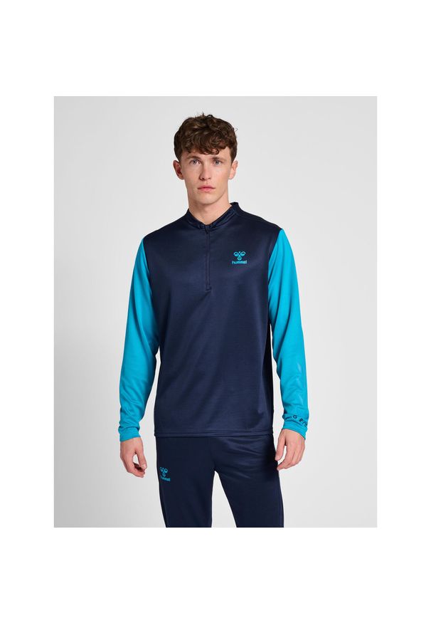 Półzapinana bluza dresowa Hummel On-Grid. Kolor: niebieski. Materiał: dresówka. Sport: piłka nożna
