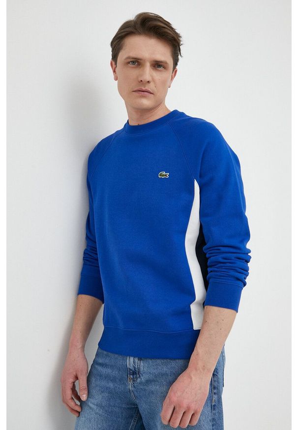 Lacoste bluza męska kolor niebieski wzorzysta. Kolor: niebieski. Materiał: dzianina. Długość rękawa: raglanowy rękaw. Wzór: aplikacja