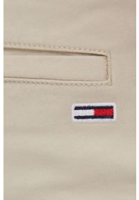 Tommy Jeans Spodnie męskie kolor beżowy w fasonie chinos. Kolor: beżowy. Materiał: materiał, bawełna, tkanina. Wzór: gładki
