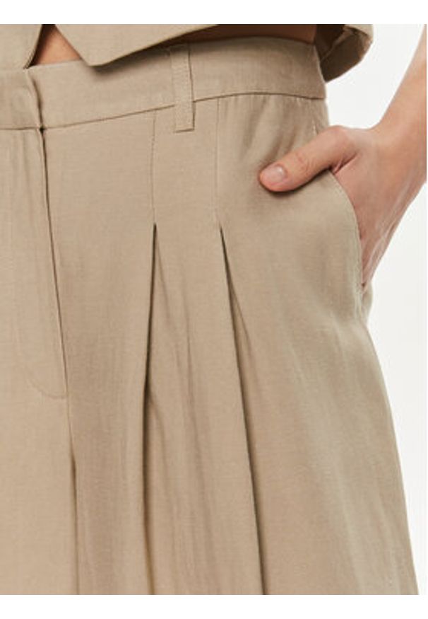 Herskind Spodnie materiałowe Lotus 5114840 Beżowy Relaxed Fit. Kolor: beżowy. Materiał: wiskoza