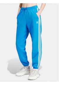 Adidas - adidas Spodnie dresowe adicolor Classics 3-Stripes IR8092 Niebieski Regular Fit. Kolor: niebieski. Materiał: bawełna