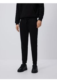 Reserved - Spodnie dresowe slim fit - czarny. Kolor: czarny. Materiał: dresówka