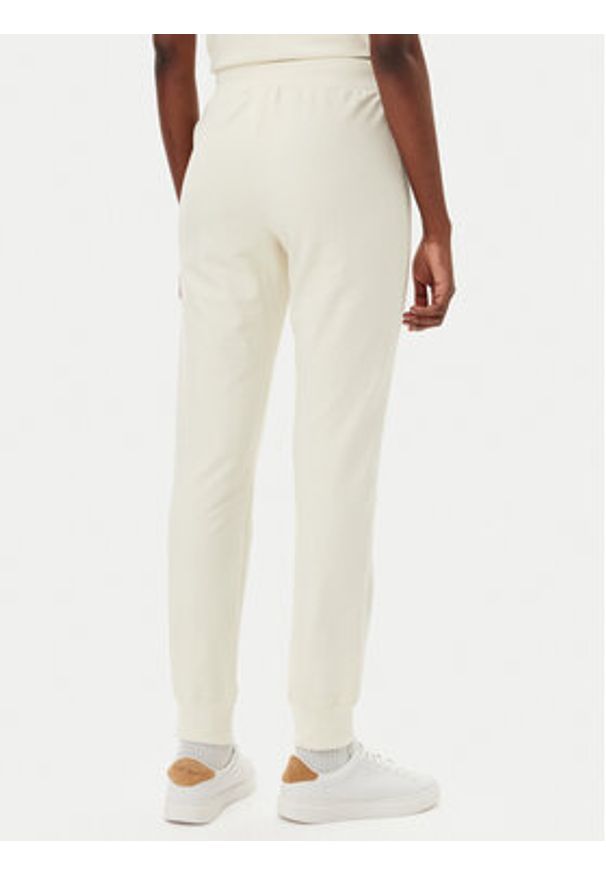 Champion Spodnie dresowe 118101 Écru Slim Fit. Materiał: bawełna