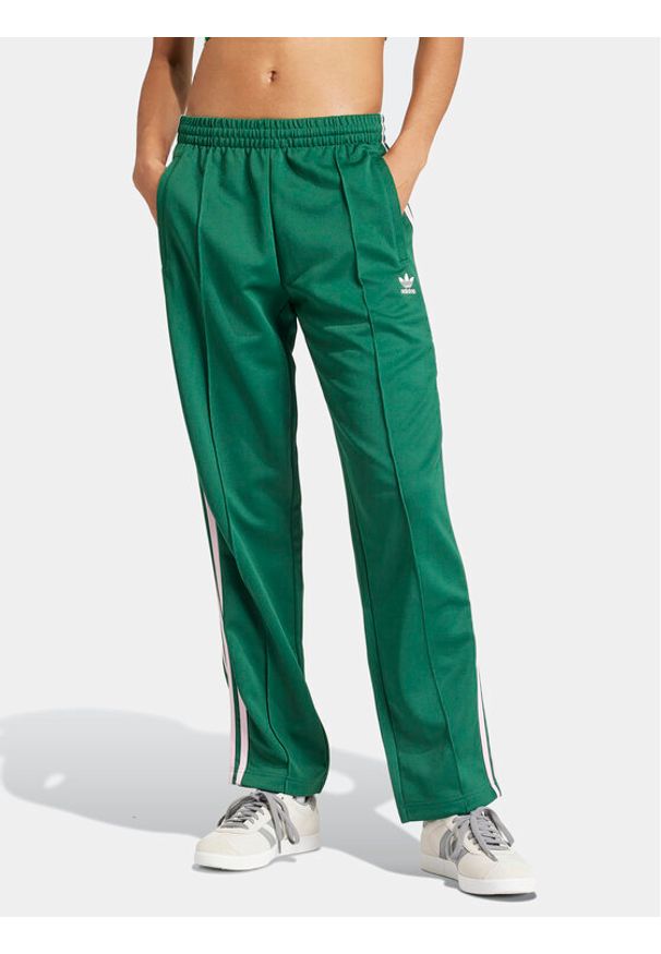 Adidas - adidas Spodnie dresowe adicolor Classics SST IM9818 Zielony Loose Fit. Kolor: zielony. Materiał: bawełna