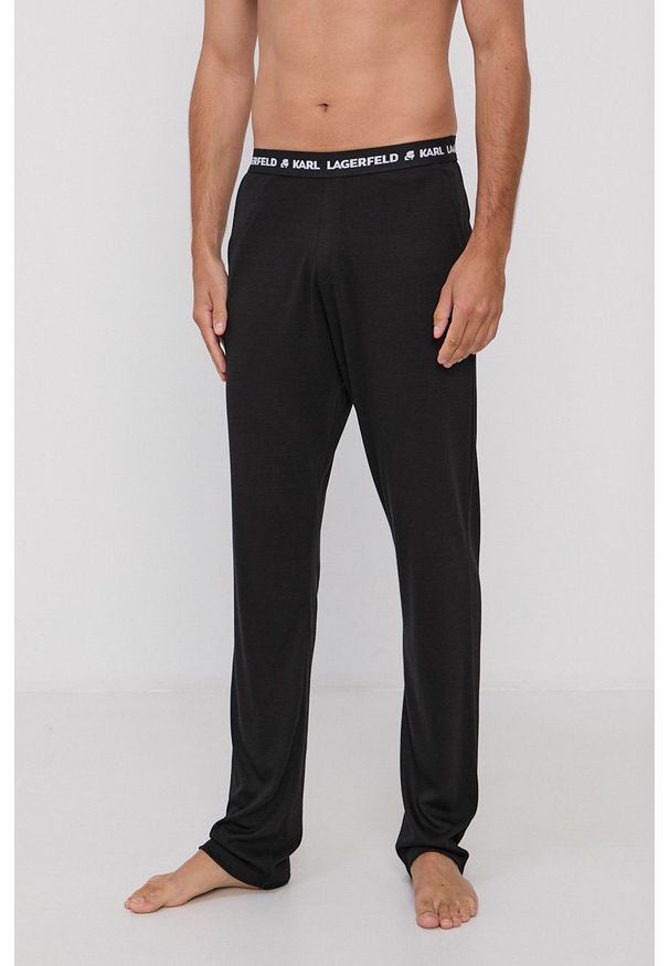 Karl Lagerfeld Spodnie piżamowe 215M2182 męskie kolor czarny gładkie. Kolor: czarny. Materiał: bawełna, materiał, dzianina, lyocell, tkanina, jedwab. Wzór: gładki