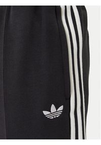Adidas - adidas Spodnie dresowe adicolor Spacer Track JX1506 Czarny Baggy Fit. Kolor: czarny. Materiał: bawełna. Sport: turystyka piesza #3