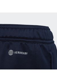 Spodnie do piłki nożnej dla dzieci Adidas Arsenal Condivo 2022/23. Kolor: niebieski, wielokolorowy, biały. Materiał: dresówka. Styl: sportowy