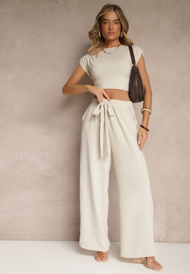 Renee - Jasnobeżowe Spodnie z Wiskozą o Szerokim Kroju z Wiązanym Paskiem Zileindra. Okazja: na co dzień. Stan: podwyższony. Kolor: beżowy. Materiał: wiskoza. Styl: casual, klasyczny, elegancki