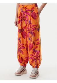 Adidas - adidas Spodnie dresowe FARM Premium JD6301 Pomarańczowy Loose Fit. Kolor: pomarańczowy. Materiał: syntetyk #1