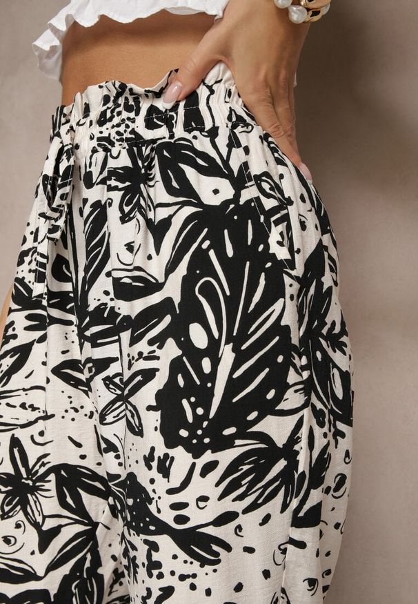 Renee - Białe Spodnie z Wiskozą o Szerokim Kroju High Waist w Kwiatowy Wzór Ellorine. Okazja: na co dzień. Stan: podwyższony. Kolor: biały. Materiał: wiskoza. Wzór: kwiaty. Styl: elegancki, casual