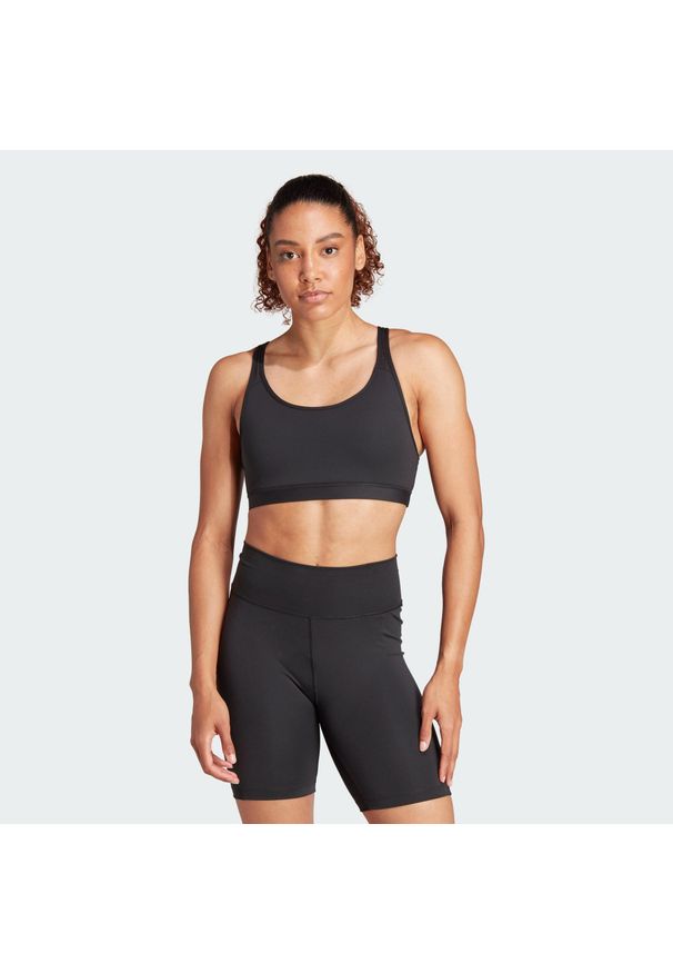 Adidas - Biustonosz All Me Essentials Medium-Support. Kolor: czarny. Materiał: materiał. Sport: joga i pilates