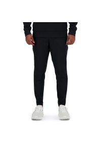 Spodnie New Balance MP41143BK - czarne. Kolor: czarny. Materiał: poliester, materiał, dresówka, bawełna. Sport: fitness