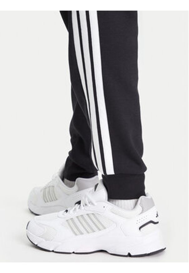 Adidas - adidas Spodnie dresowe Essentials 3-Stripes JD1861 Czarny Regular Fit. Kolor: czarny. Materiał: bawełna
