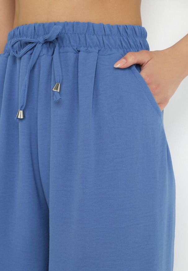 Born2be - Granatowe Szerokie Spodnie z Gumką w Pasie Sliverta. Kolor: niebieski