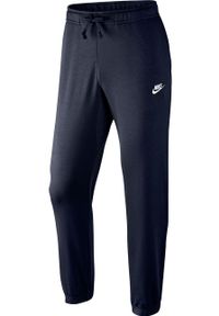 Nike - Spodnie. Kolor: niebieski. Materiał: bawełna, poliester, dzianina. Wzór: gładki #1