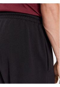 Reebok Spodnie dresowe Identity IN1684 Czarny Regular Fit. Kolor: czarny. Materiał: bawełna