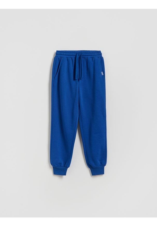 Reserved - Bawełniane spodnie jogger - niebieski. Kolor: niebieski. Materiał: bawełna