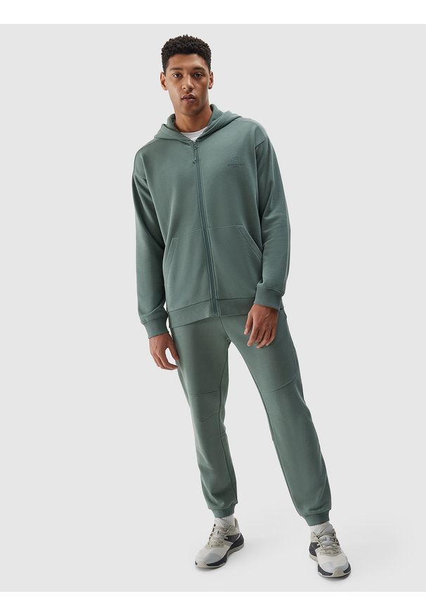4f - Spodnie dresowe joggery z bawełny organicznej męskie - khaki. Kolor: brązowy, wielokolorowy, oliwkowy. Materiał: dresówka, bawełna. Wzór: gładki, ze splotem