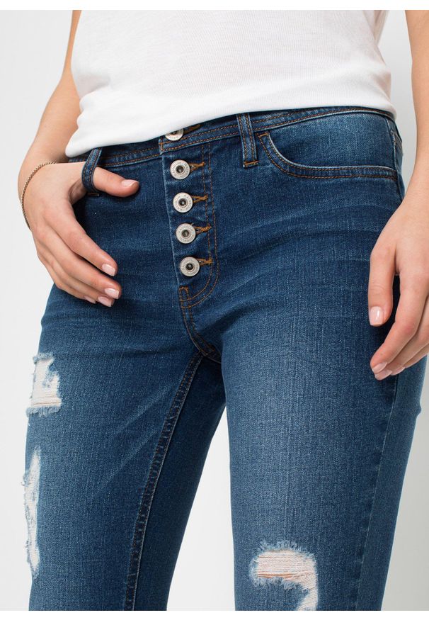 bonprix - Krótsze dżinsy z ozdobnymi przetarciami. Kolor: niebieski. Długość: krótkie