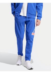Adidas - adidas Spodnie dresowe Future Icons Badge of Sport IS9594 Niebieski Regular Fit. Kolor: niebieski. Materiał: bawełna