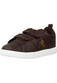 Le Coq Sportif - Kapcie LE COQ SPORTIF COURTCLASSIC INF Brązowy. Kolor: brązowy. Materiał: tkanina, skóra. Sport: turystyka piesza