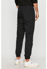 Nike Sportswear - Spodnie. Kolor: czarny. Materiał: tkanina, nylon, materiał, poliester. Wzór: gładki #3