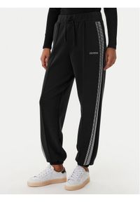 Guess Spodnie dresowe V6RB01 KCAY2 Czarny Regular Fit. Kolor: czarny. Materiał: syntetyk #1