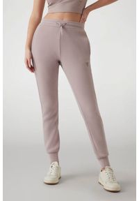 Guess - GUESS Dresowe damskie spodnie w kolorze taupe Allie Scuba, Rozmiar M. Kolor: beżowy. Materiał: dresówka #1