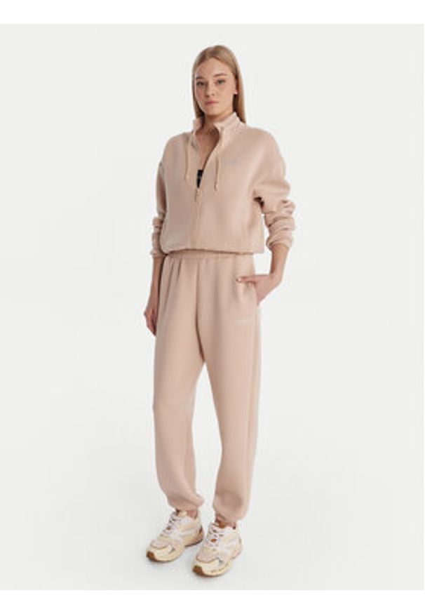 Guess Spodnie materiałowe 169841 Beżowy Slim Fit. Kolor: beżowy. Materiał: wiskoza