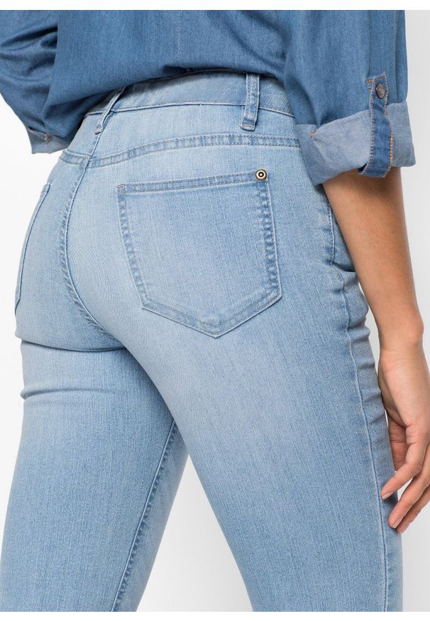 bonprix - Wygodne dżinsy ze stretchem o kroju bootcut, mid waist. Kolor: niebieski