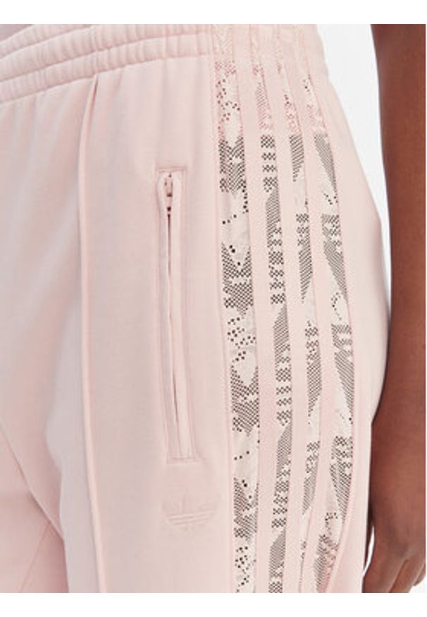 Adidas - adidas Spodnie dresowe Firebird Lace KC6444 Różowy Loose Fit. Kolor: różowy. Materiał: syntetyk, bawełna